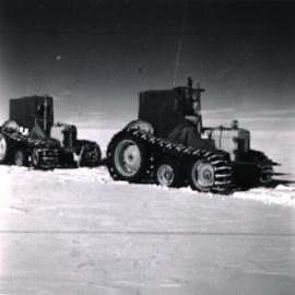 Ferguson tractor "Sue" with sun compass, leads across the undulating Polar Plateau, roped to the tractors behind
