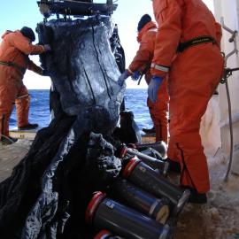 Crew launching the 'MOCNESS' - Multiple Opening and Closing Net and Environmental Sampling System. Nicknamed the 'octopus', it has nine trigger nets that open and close at set depths. This allows the collection of zooplankton from different depths ranges