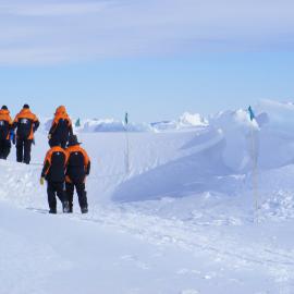 Scott Base staff walk along the pressure ridges outside Scott Base: November 2008