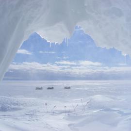 Antarctica New Zealand skidoos viewed through the entrance to the ice cave in the Erebus ice tongue, December, 2008