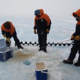 Collecting ice algae from a Jiffy drill hole 5 m deep on the sea ice