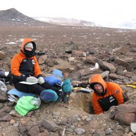 Fiona Shanhun and Peter Almond describing and sampling a soil pit. "Unnamed Valley", Darwin Mountains.