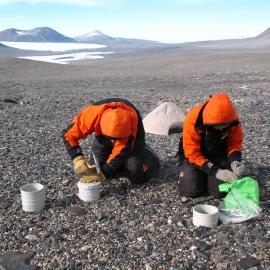 Peter Almond and Fiona Shanhun installing gas chambers and depth sampling tubes. Eastern Taylor Valley.