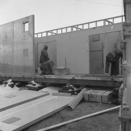 Erecting huts at Mawson