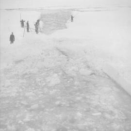 Poling ice away to make passage through Weddell Sea pack ice for 'Theron'