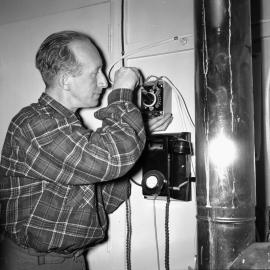 Ted Gawn installing fan 