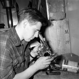 Guyon Warren at a Microscope