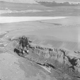 Dr Ronald Balham examines gullied stream bed 