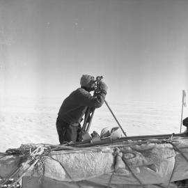 ob Miller observing noon-sight (Southern Survey Party)