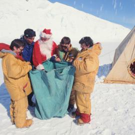 Father Christmas Checking Deliveries