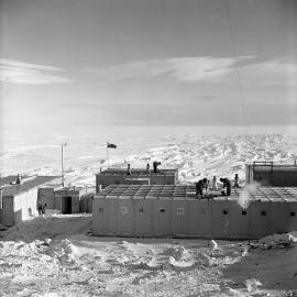 Brushing snow from roof