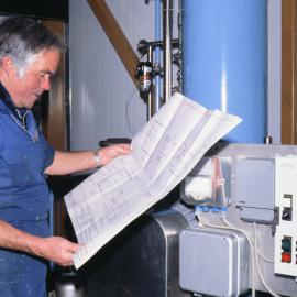 Bob Dunnachie Studying the Reverse Osmosis Plant Plans