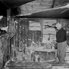 Eric Gibbs inspects an old piece of Canned Goods