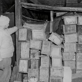 Eric Gibbs and Stacks of Old Biscuit Crates