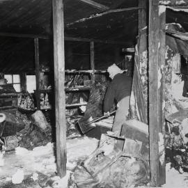 Eric Gibbs Shovelling Snow inside Scott's "Discovery' Hut