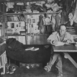 Captain Robert Falcon Scott at Work in His 'Den' at Cape Evans