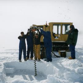 Asisting K057 drilling a fishing on sea ice 