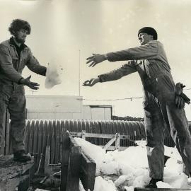 Loading ice into ice melter 