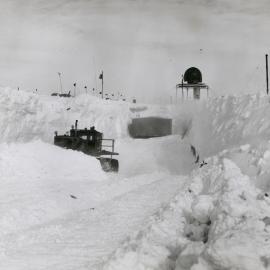 Tractor excavates a ramp for the new garage 