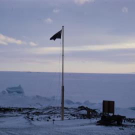 NZ Flag at Scott Base at Night Time
