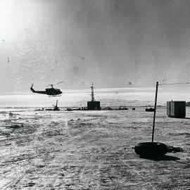 Helicopter arriving at DVDP site