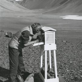 Meterological technician Mike Fraser changes a weather screen