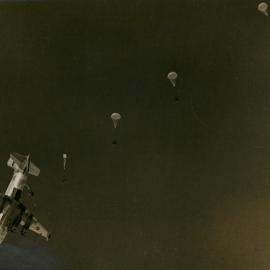 Fuel drums being dropped by parachute to Byrd Station