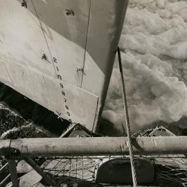 Bow of the USS 'Arneb' being towed into 'V' notch of the USS 'Glacier' in preparation 