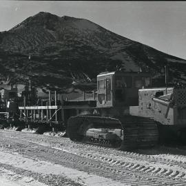 Caterpillar D8 hauling three sledges