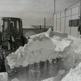 Clearing snow from site of new command centre
