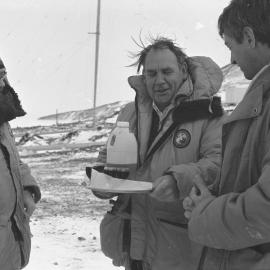Commodore Tempero offers around tray of rum