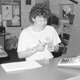 Jeanette May at Telecoms counter
