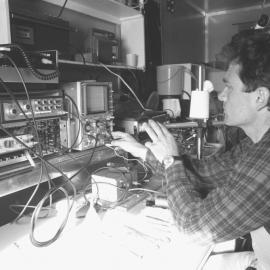 Science| biology| John Montgomery| adjusting equipment to measure frequencies 