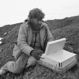 Jack McConchie from Victoria Uni working with personal computer in the field  