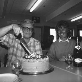 Cas Roper cutting cake at Scott base dinner