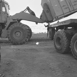 Containers being loaded before being returned to New Zealand