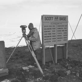 Pat R Sole checking the alignment of his surveying gear