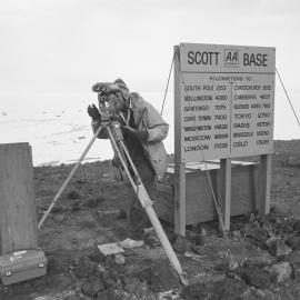 Pat R Sole checking the alignment of his surveying gear