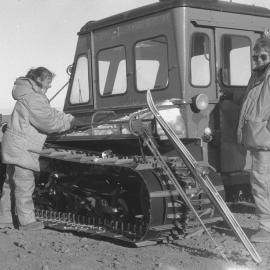 Biddy Harnett|  and Heather Gilmore| loading skis on SnowMaster