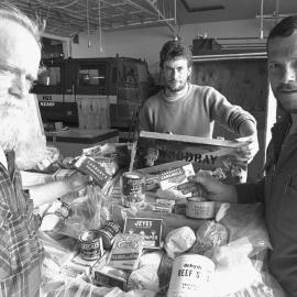 Garth Varco, Nigel Crabbe and Jack Jenniskens with the NZGS food and fuel cache they and Cath Gilmour recovered from Igloo Spur