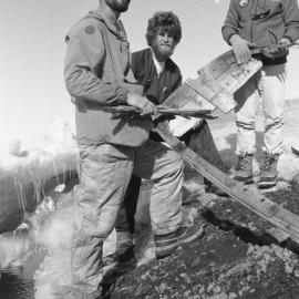 Ross McDonald| Phil Clerke| Dave Geddes| with parts of the dinghy| 