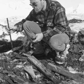 Fed Menk cleaning up rubbish from first years at Scott Base