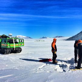 Sea ice drilling during traverse out to Granite Harbour