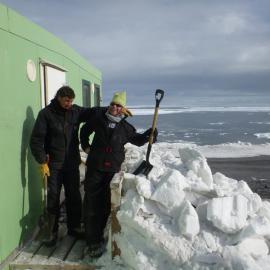 Digging out the Cape Bird hut buried in snow after the winter