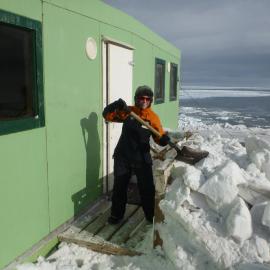 Digging out the Cape Bird hut buried in snow after the winter
