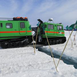 H1 crosses a large open water crack near the Erebus Glacier tongue on its way out to Cape Evans