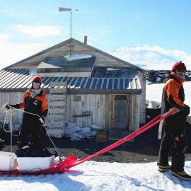 AHT’s Lizzie Meek and Josiah Wagener prepare to move artefacts from Scott’s Terra Nova Hut to the nearby conservation laboratory at Cape Evans