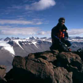 Dr Ed Butler sitting atop Mount Jason