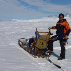Cliff Atkins in sled harness and linked glacier travel