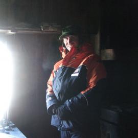 Visitor in Historic Hut